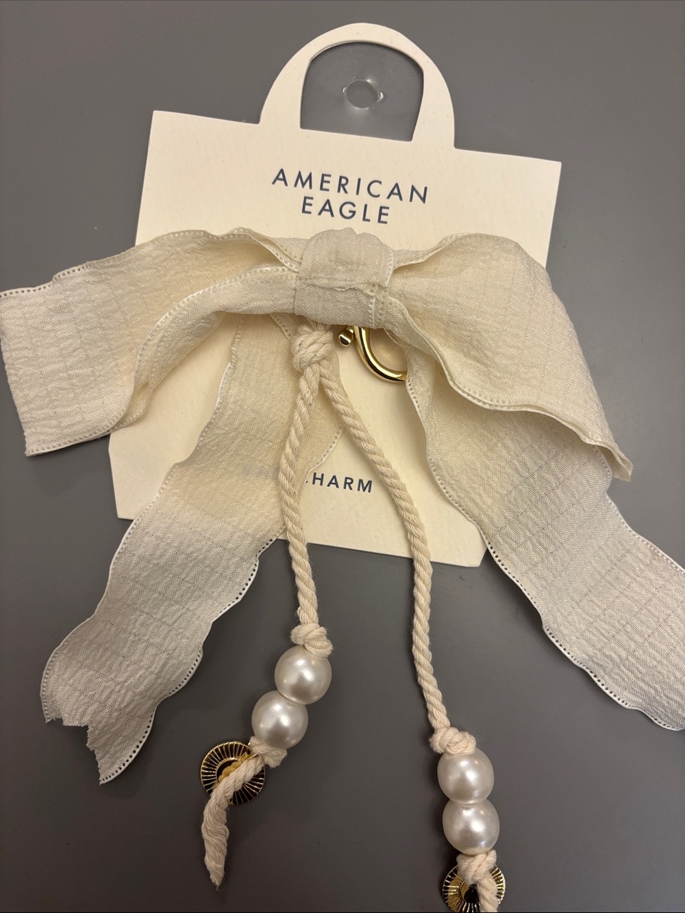 American Eagle Cream/White Bow Bag Charm w/Gold Sun Charms & Pearl Beads